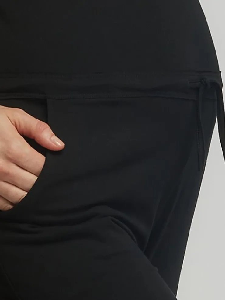 Dame Dansebutikken Sort løs heldragt med bredde stropper